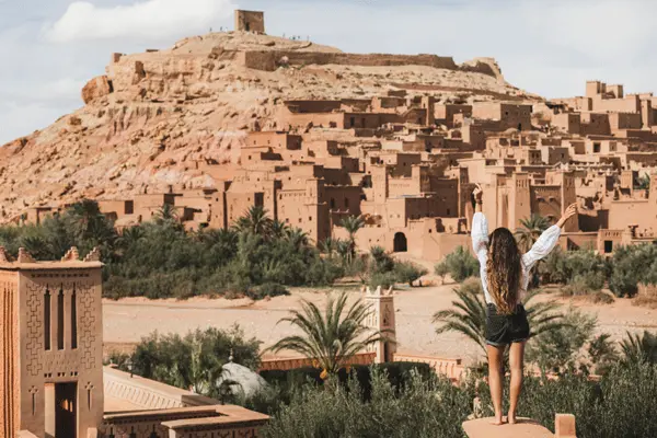 The ancient Kasbah of Ait Ben Haddou under a clear blue sky in spring.
